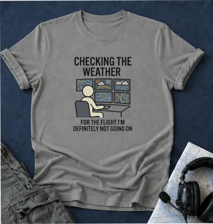 Weather-Obsessed Pilot Shirt – “Checking the Weather… For the Flight I’m Definitely Not Going On” T‑Shirt